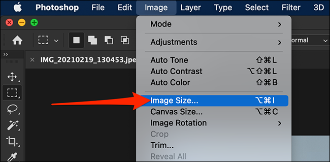 Select "Image > Image Size" from Photoshop's menu bar.