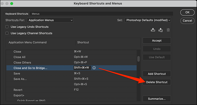 Select "Delete Shortcut" on the "Keyboard Shortcuts and Menus" window in Photoshop.
