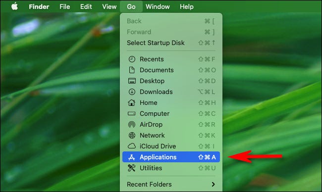 In Finder, click the "Go" menu and select "Applications" from the list.