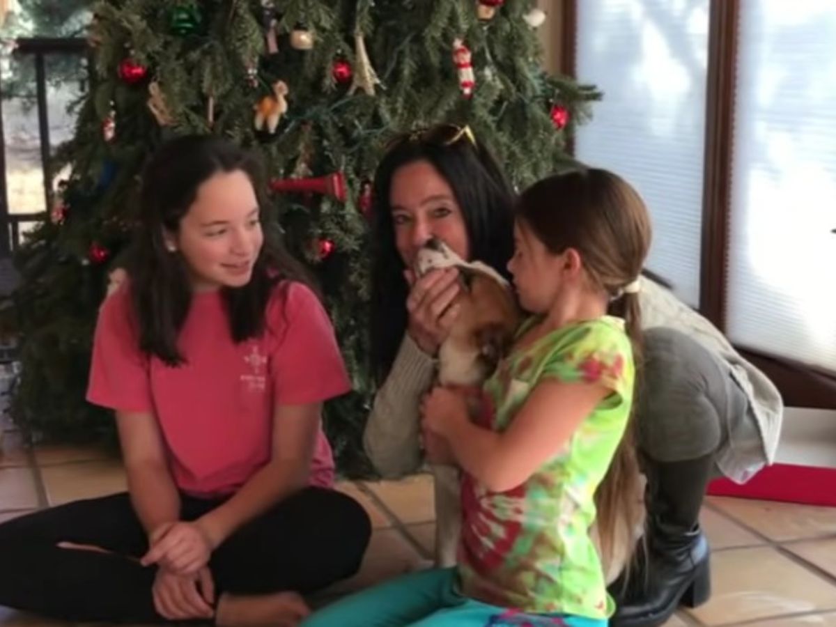 a-woman-with-two-little-girls-and-a-foster-dog a woman with two little girls and a foster dog