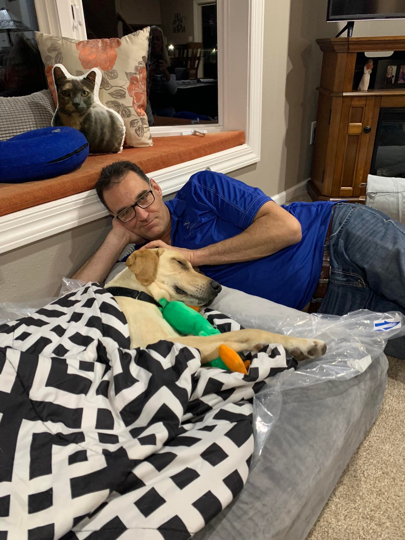 guy-laying-next-to-dog guy laying next to dog