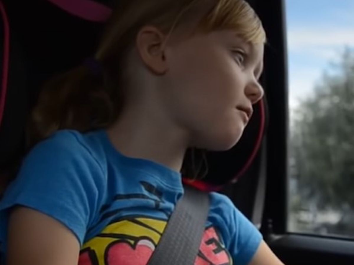 little-girl-looking-through-car-window little girl looking through car window