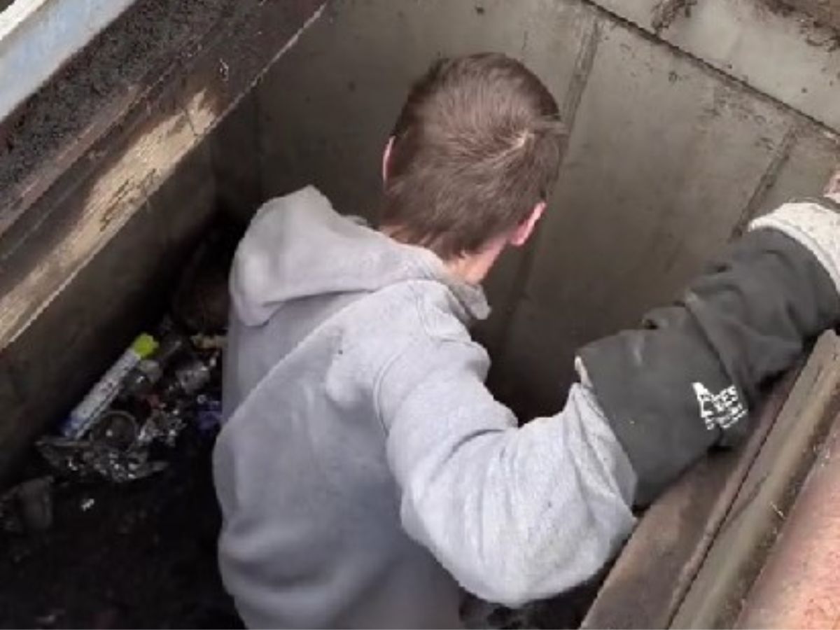 man-in-drain-hole man in drain hole